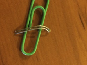 With a novelty size paperclip